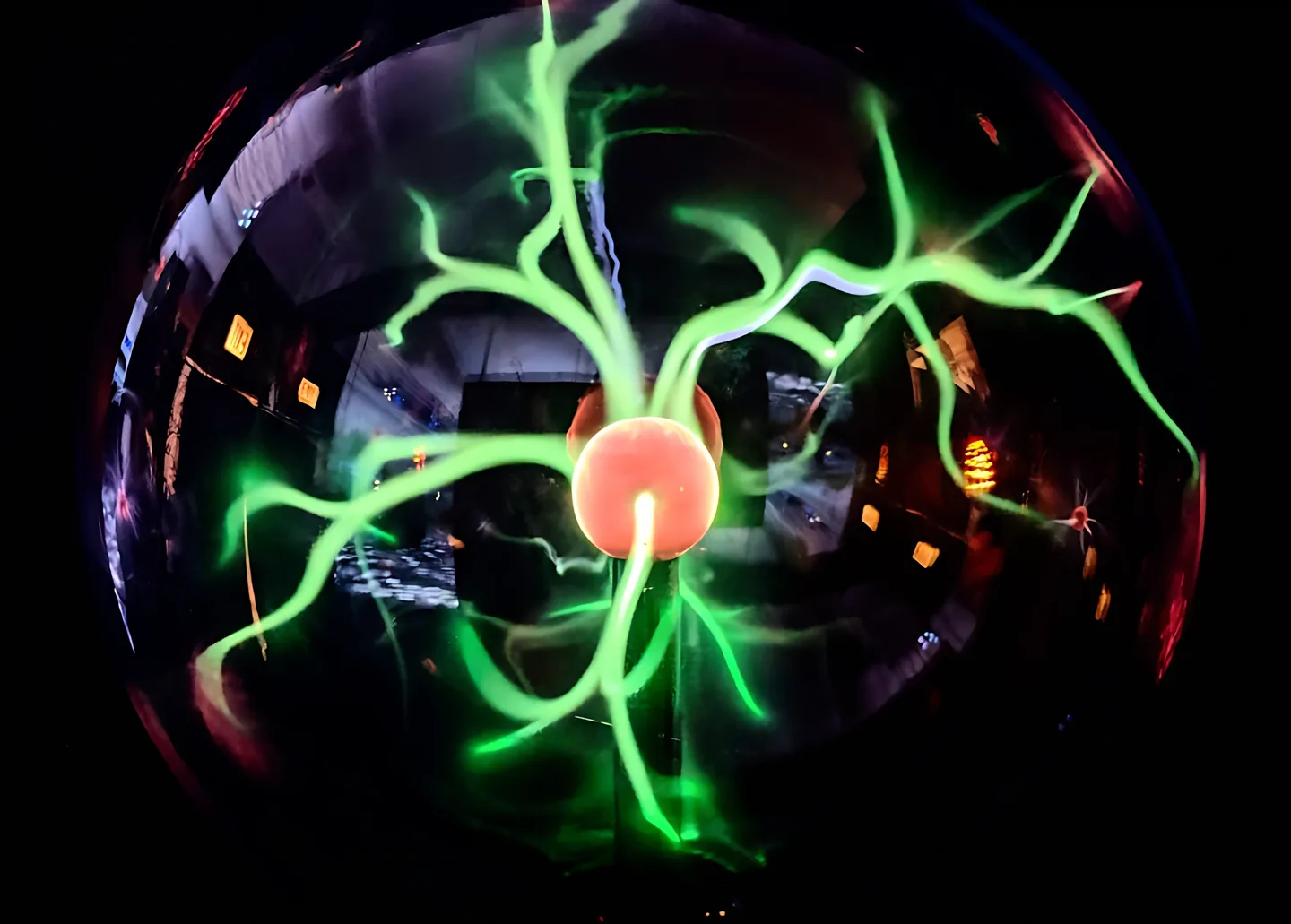 Plasma sphere with green electrical filaments